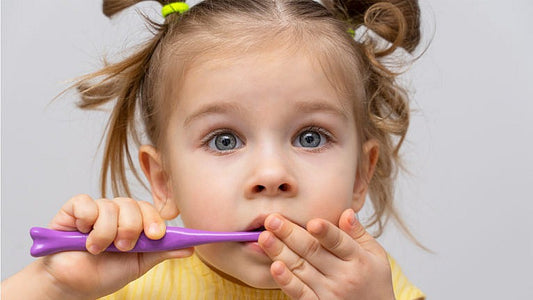 How to brush your toddler's teeth when she's not into it